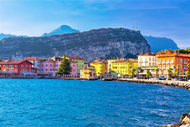A view accross Lake Garda to the colourful village of Torbole - Itlay